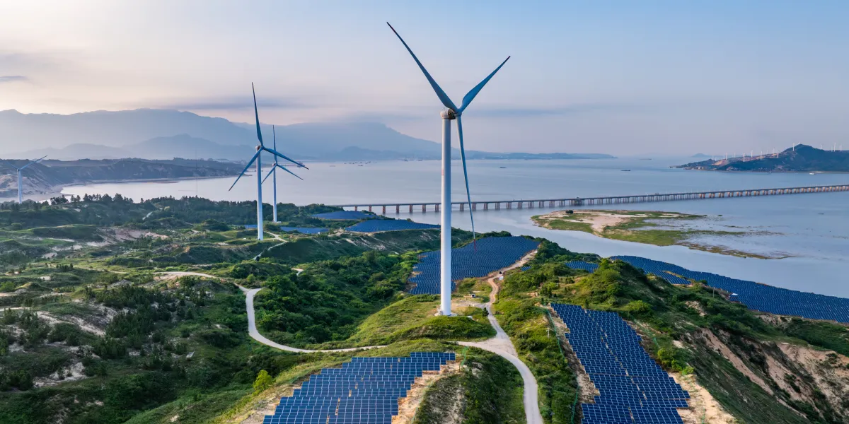 Solar photovoltaic windmill wind energy at sunset