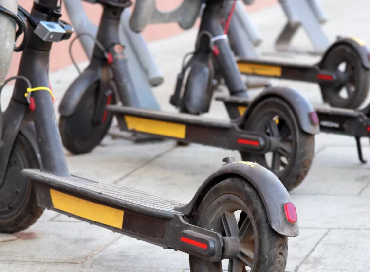A row of battery powered scooters. Exponent provides electrical engineering support for consumer products.