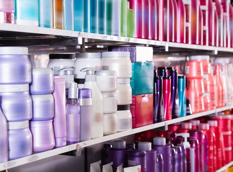 Hair products and personal care products on store shelves.  Exponent's product analysis Improves safety and performance of products.