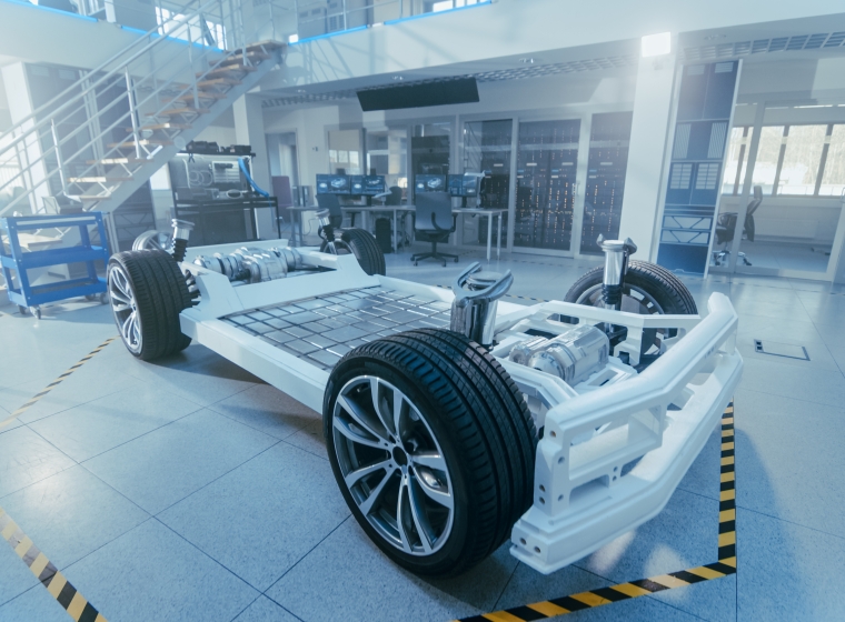 Electric Car Platform Prototype Standing in High Tech Industrial Machinery Design Laboratory. Hybrid Frame include Tires, Suspension, Engine and Battery.