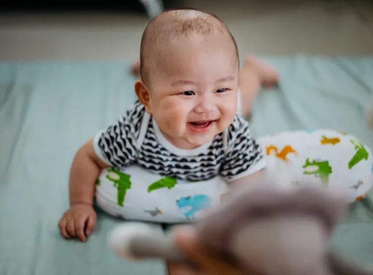 Baby having tummy time on mattress