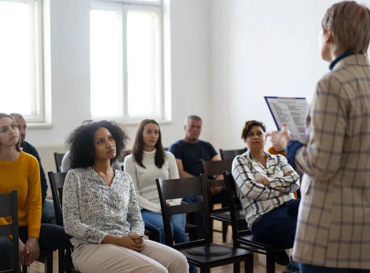 woman standing in front of a audience