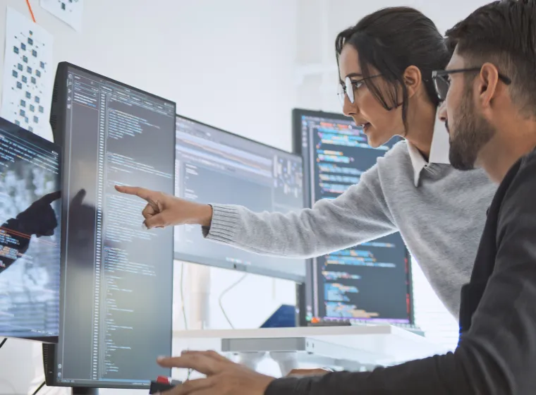 Hispanic Latin American couple, software engineer developer use computer, work on program coding together at home office. Programming language development technology, freelance job concept