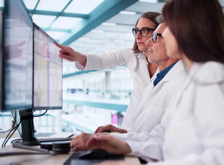 Busy Healthcare Team Using Medical Billing Coding Software In Hospital.