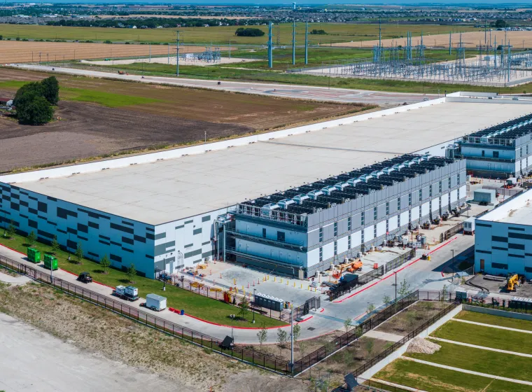 Aerial view of a large data center campus with focus on the processor hosting area and power and cooling infrastructure being built in Hutto TX