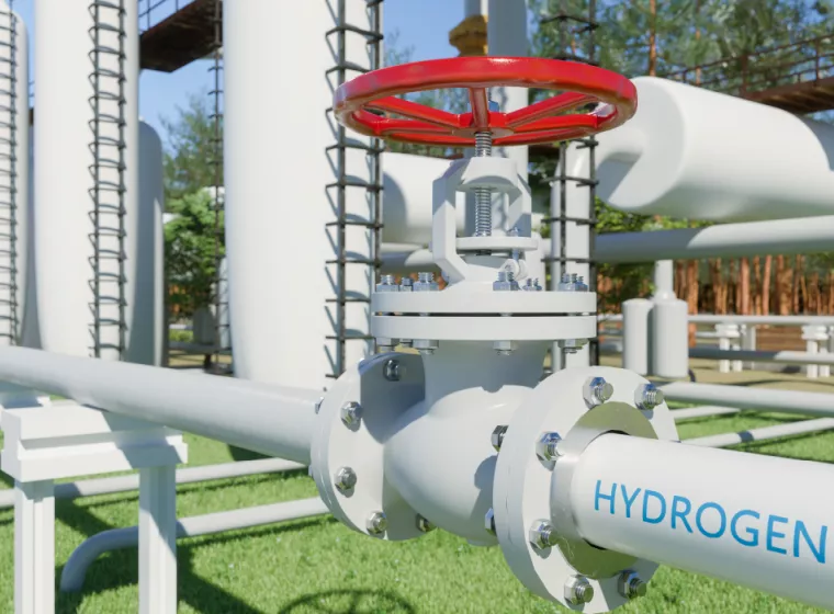 A close up of a pipe labeled hydrogen at a hydrogen plant