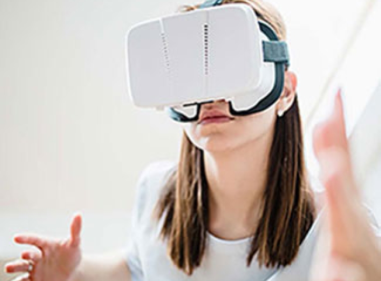 Person wearing a virtual reality headset. Exponent  helps innovators explore the possibilities of virtual reality products.