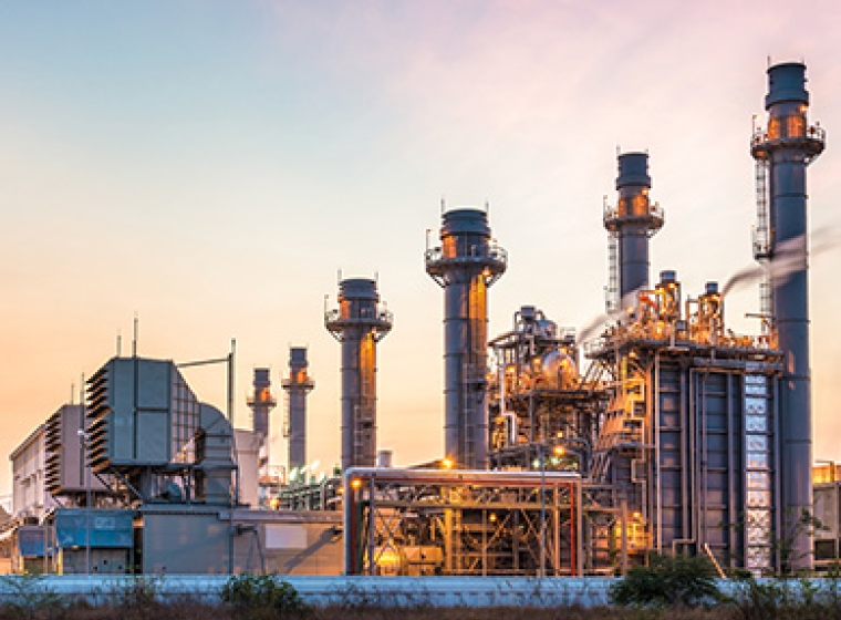 An industrial refinery shown in the golden sunset. Exponent provides expert support for chemical engineering challenges.