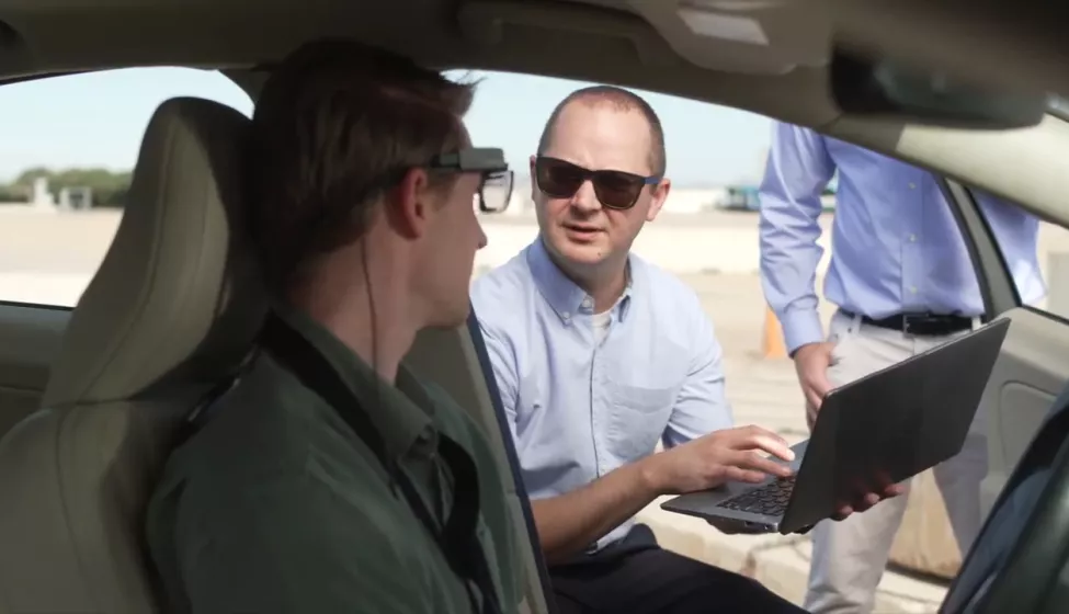 A man consults with an automotive tester