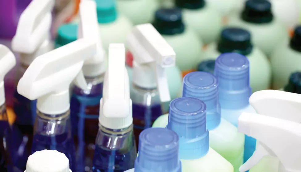 A close up of a stock of various spray bottle products