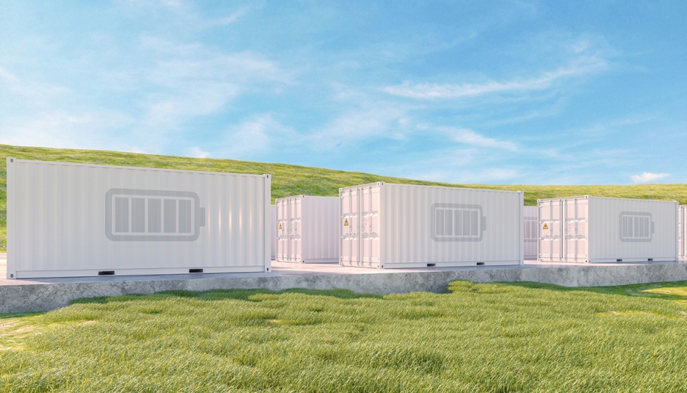 Shipping containers in a grassy field with a battery logo printed on each of them