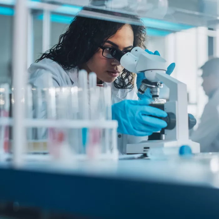 Portrait of Scientist Looking Under the Microscope