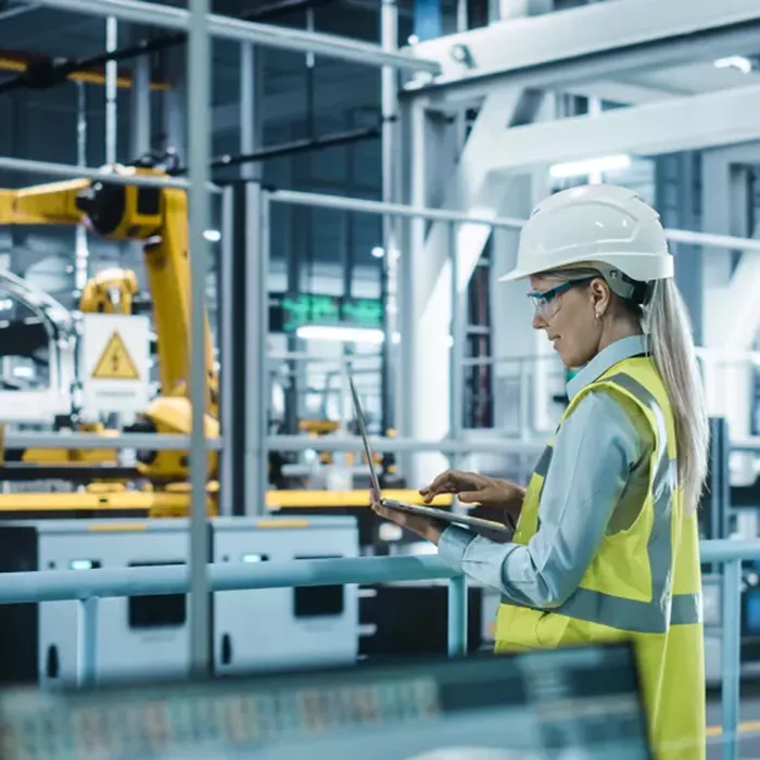 Woman in hardhat at work