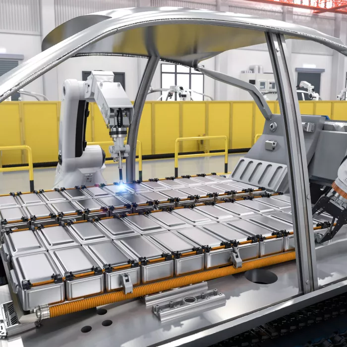Robot assembly line with electric car battery cells module on platform