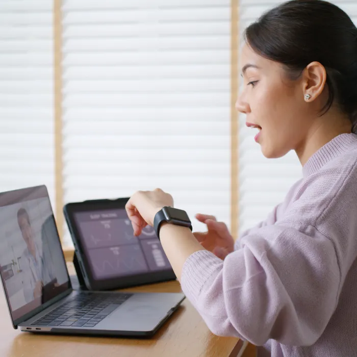 Asia people young woman video call talk chat help guide online at home by AI tele consult telehealth telemedicine app clinic in IoT device collect ECG data heart pulse sleep rate on cloud computing