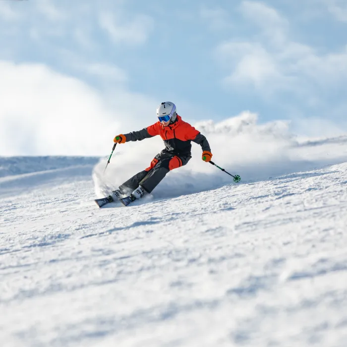 Teenage boy spending winter holiday skiing in mountain