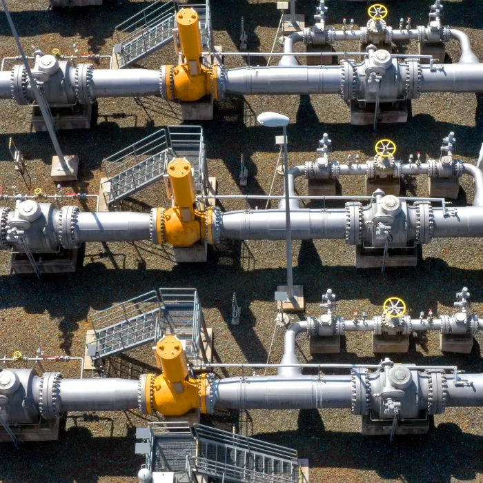 Natural gas pipeline in European Union. High pressure pipes on a hot summer day.