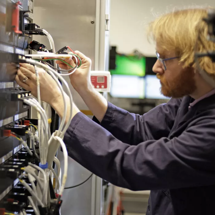 Engineer Testing a Battery