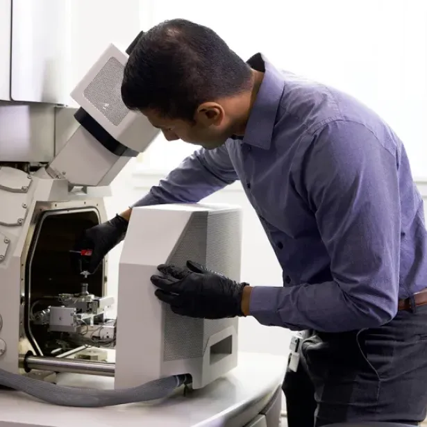 Exponent scientist operating equipment in a lab