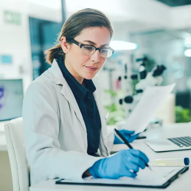 Woman scientist writing
