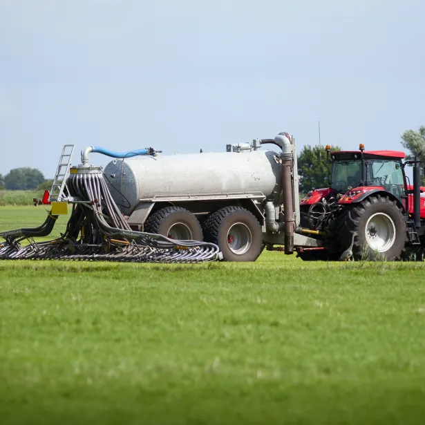 tractor with tank that can directly inject liquid manure into the ground for optimum nutrient placement and odor control