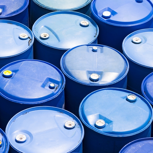 Chemicals in blue drum barrels. Exponent test and chemicals to help develop prevent fire hazards. 