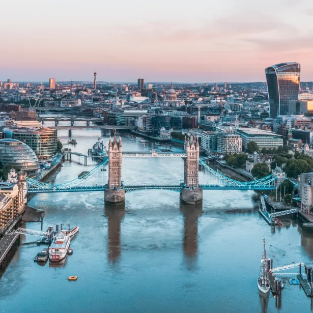 Major metropolitan city and channel of water with bridges and boats