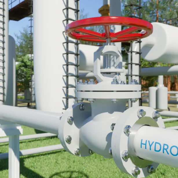 A close up of a pipe labeled hydrogen at a hydrogen plant