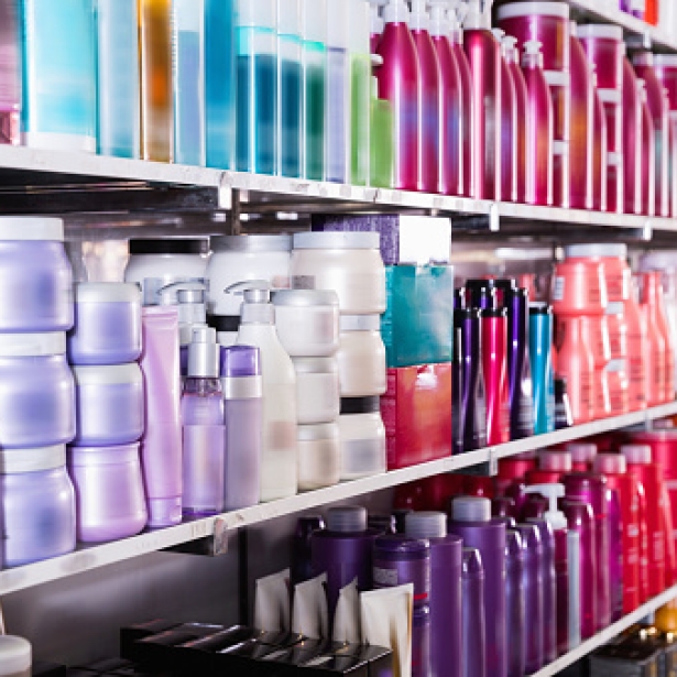 shelves with conditioners and mousses for hair in the store