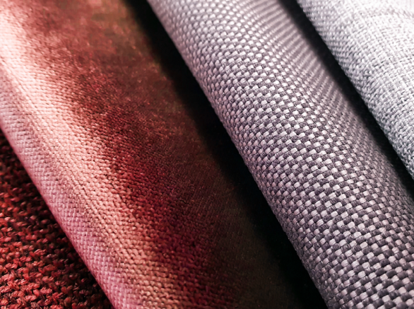 Close up of different textured and colored upholstery fabric samples