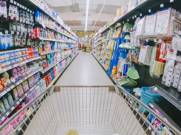 shopping cart in supermarket aisle