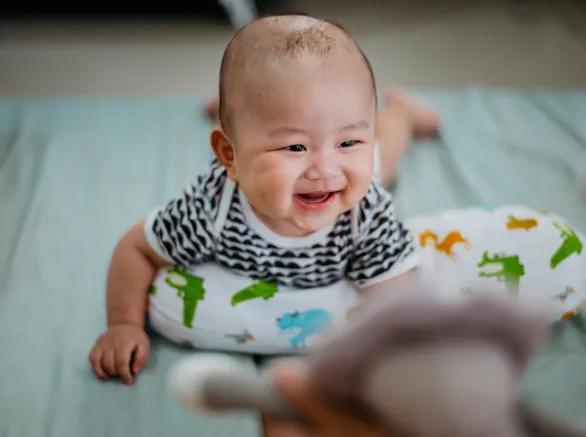 Baby having tummy time on mattress
