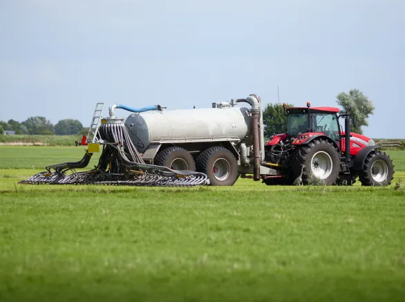 tractor with tank that can directly inject liquid manure into the ground for optimum nutrient placement and odor control