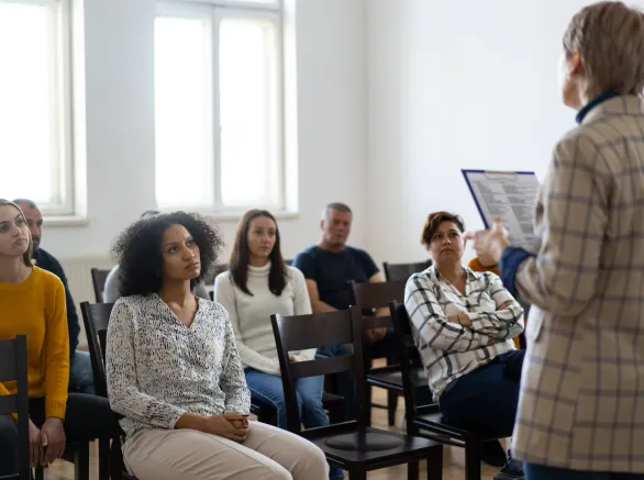 woman standing in front of a audience