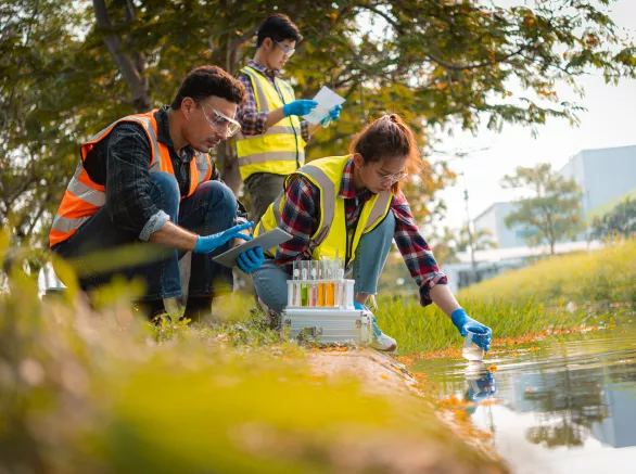 Scientists team collect water samples for analysis and research