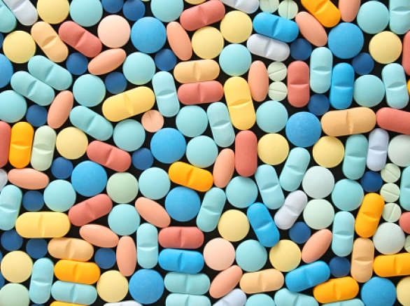 various colorful pills spread across a flat surface