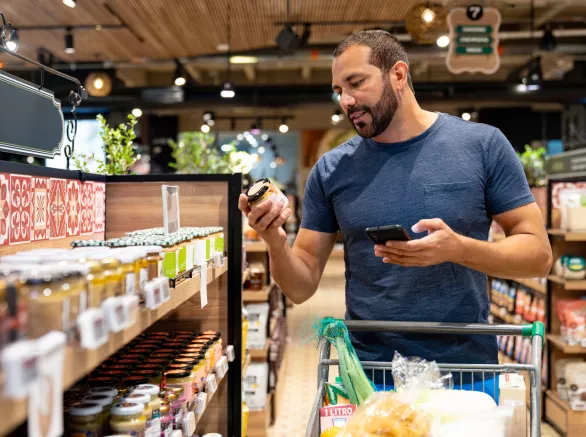 Healthy eating man shopping for organic products at the supermarket