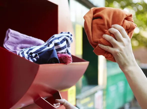 Recycling Clothes At Clothing Bank