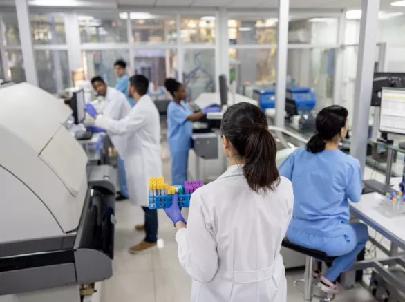 Scientists working at the laboratory processing blood samples