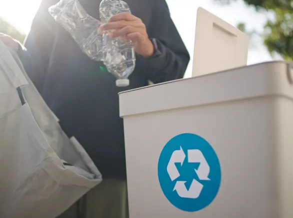 Man separating waste plastic bottle.