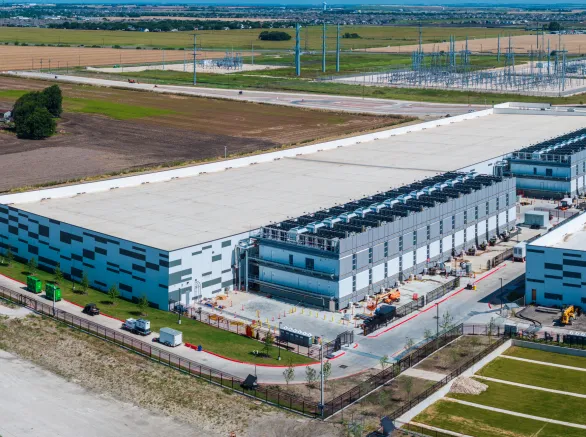 Aerial view of a large data center campus with focus on the processor hosting area and power and cooling infrastructure being built in Hutto TX