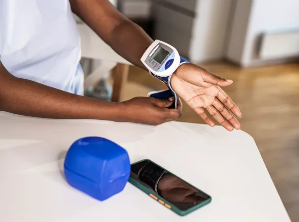 Young woman measuring a blood pressure at home
