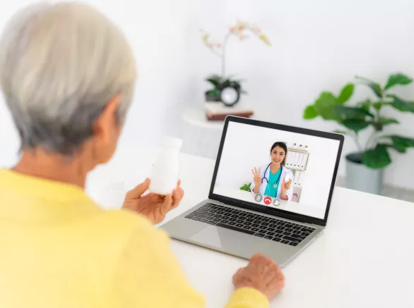 A patient on a telemedicine meeting with their doctor