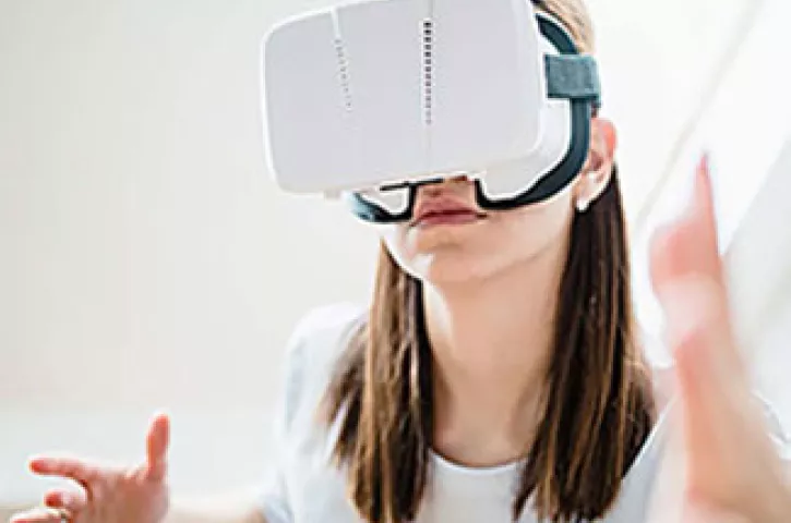 Person wearing a virtual reality headset. Exponent helps innovators explore the possibilities of virtual reality products.