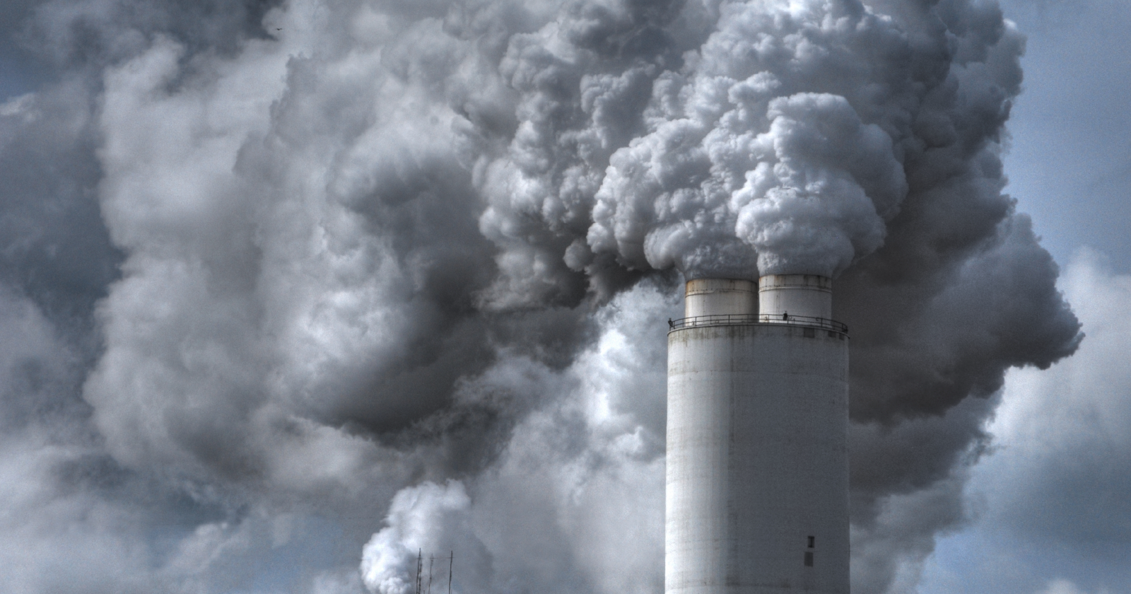 Emissions rising from industrial smokestacks. Exponent conducts technical analyses to help determine emissions liability. 