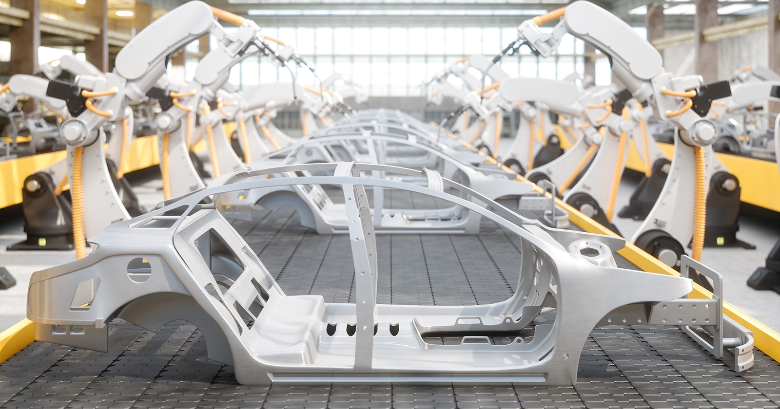A side view of car frames on a robotic assembly line. Exponent provides support for all vehicle engineering challenges. 