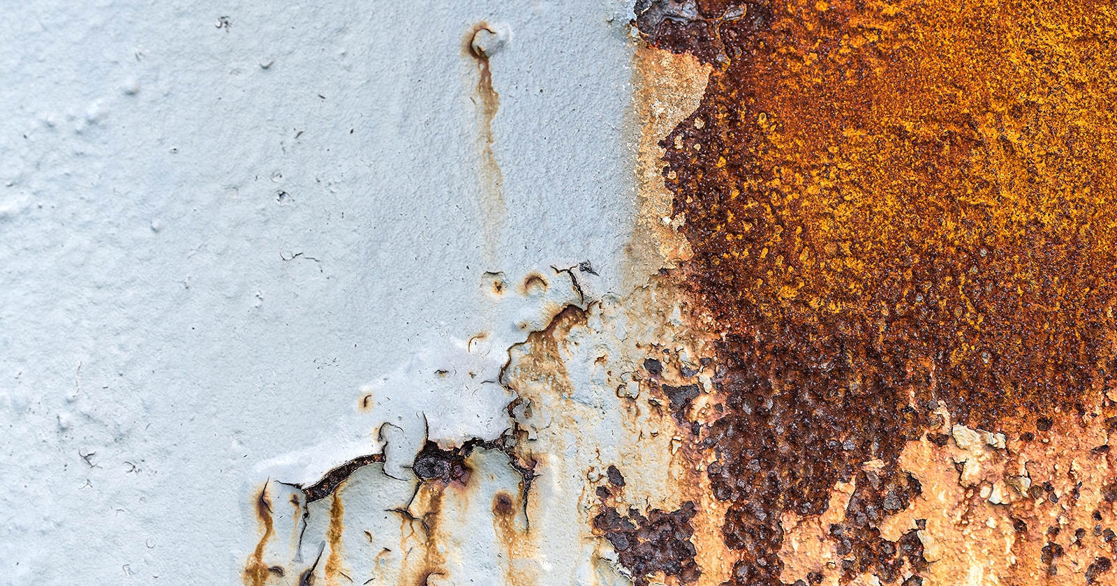 Exposed rust and flaking material on an exterior surface. Exponent materials and corrosion engineering support.