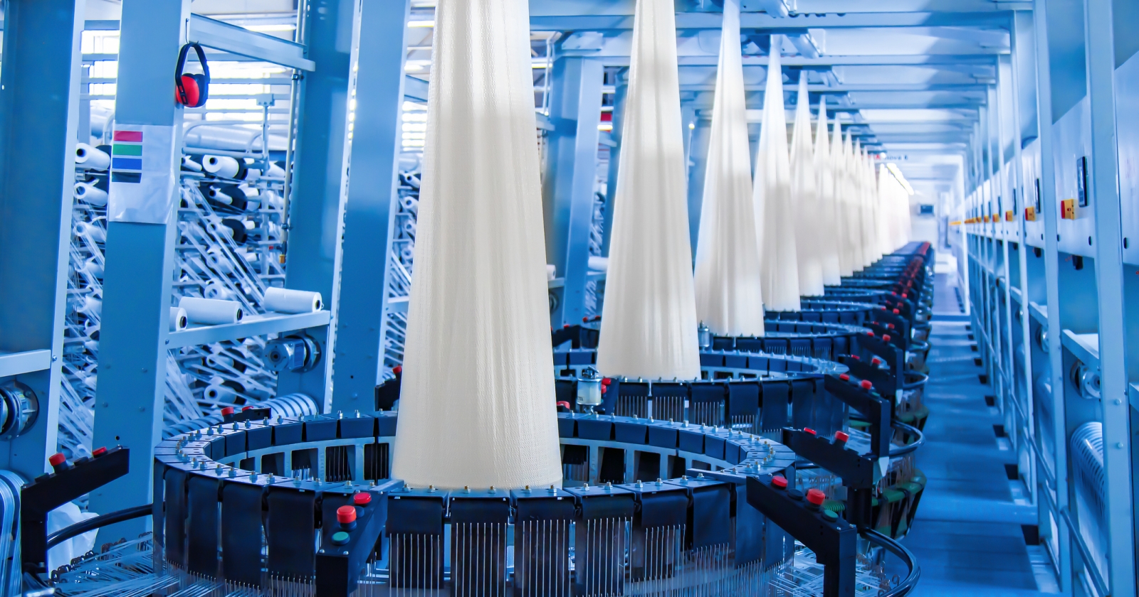 Production of white polypropylene flat yarn for the production of industrial bags. Allison-circular loom woven bag machine. Production of polypropylene sleeves.