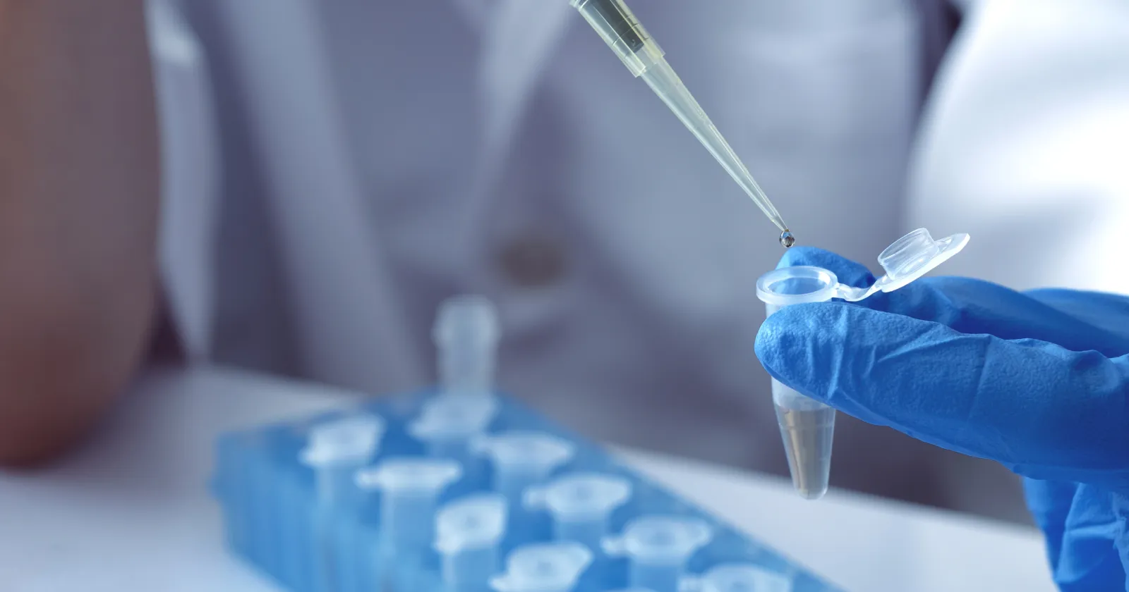 scientist using auto-pipette with Eppendorf consumables tube in the lab,Doing experiment for product,The researchers analyzed to find the results of the experiment.