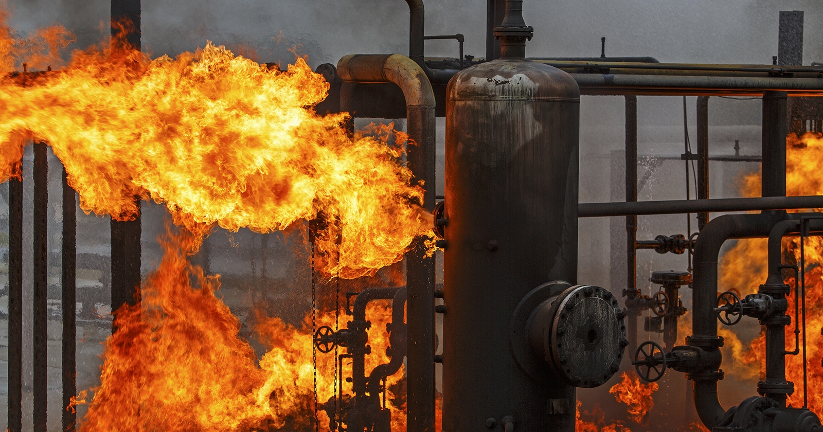 Industrial gas pipes in a blaze of fire. Exponent performs investigations of fluid combustion systems.